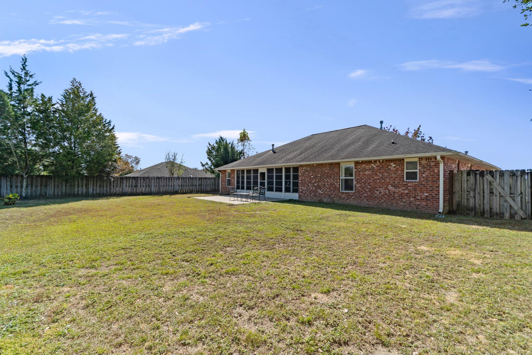 664 Brunson Street Crestview, FL 32536 - Photo 48 of 49 a view of a house with a yard