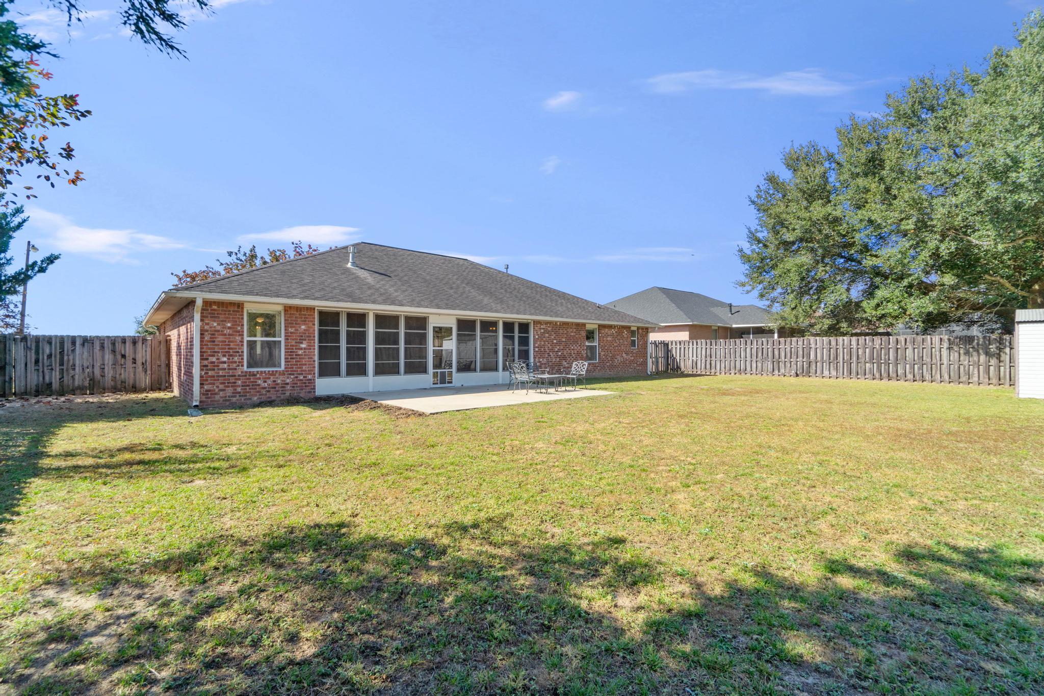 664 Brunson Street Crestview, FL 32536 - Photo 49 of 49 a front view of a house with a swimming pool