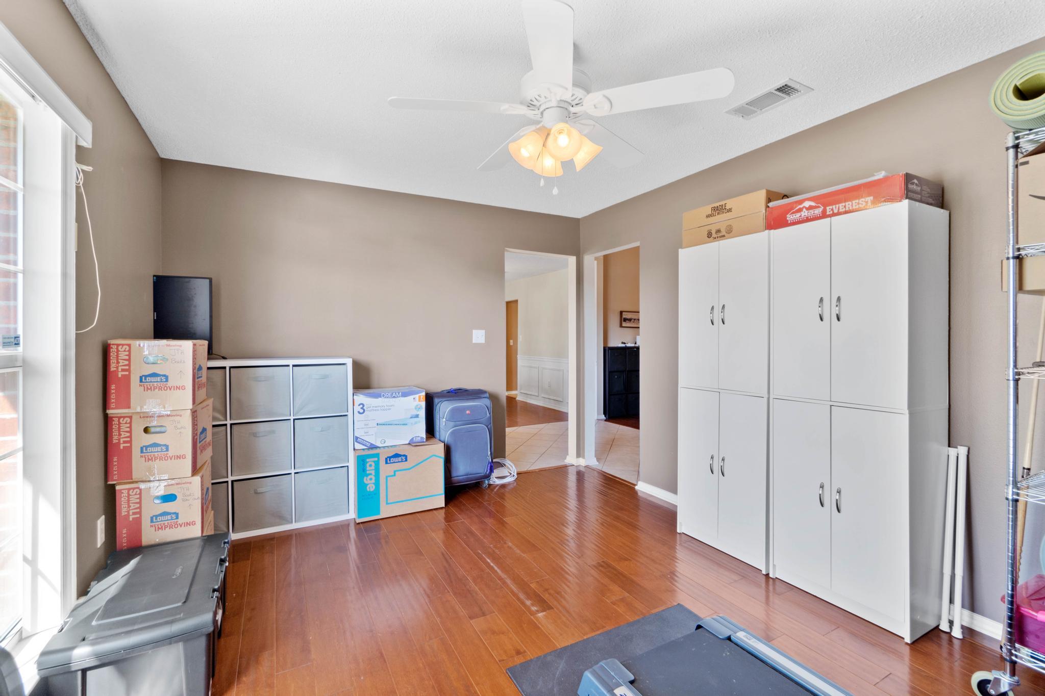 664 Brunson Street Crestview, FL 32536 - Photo 8 of 49 a view of kitchen with furniture and wooden floor