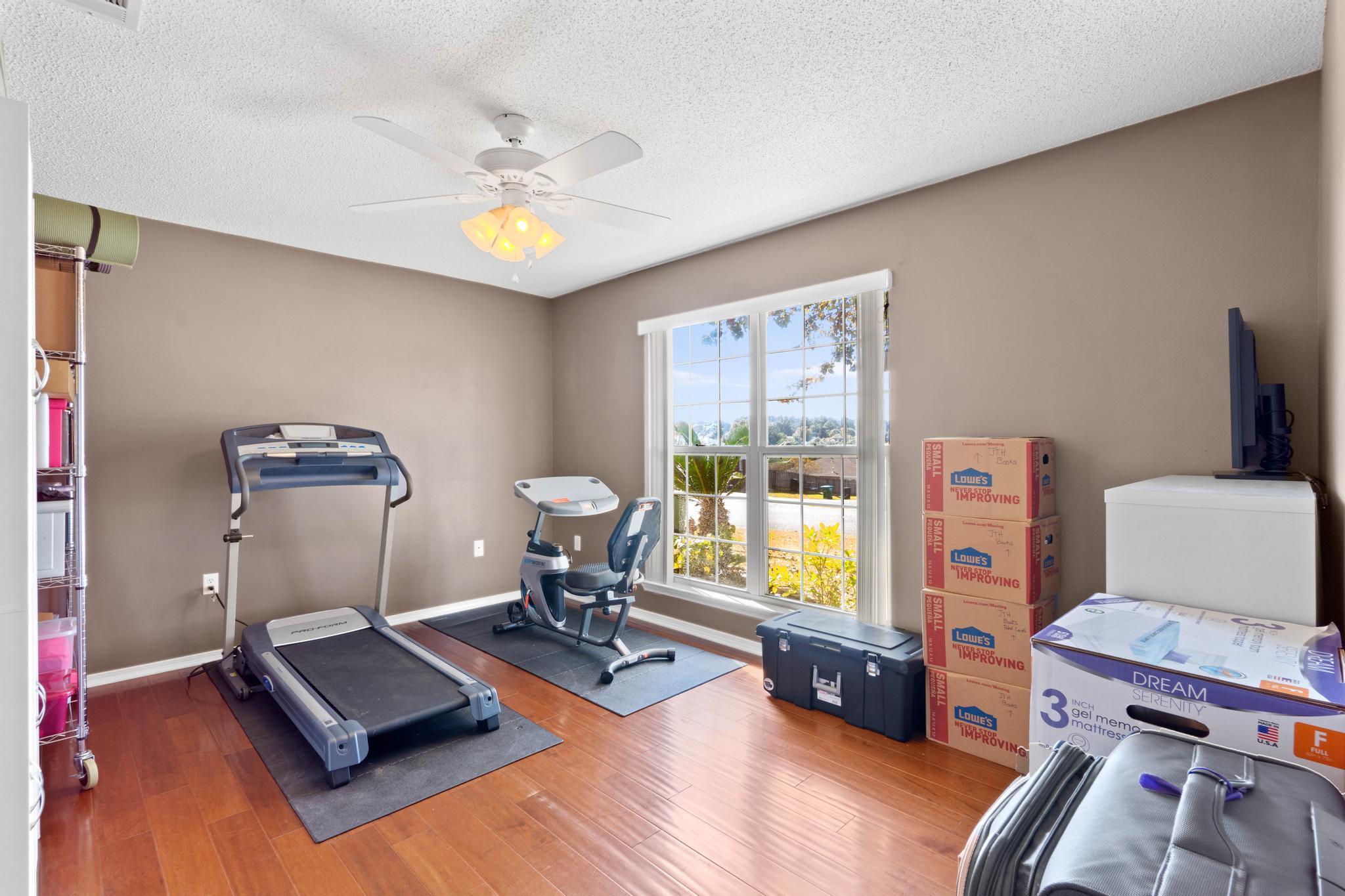 664 Brunson Street Crestview, FL 32536 - Photo 9 of 49 a living room with furniture and a window