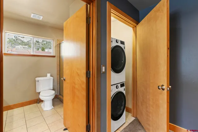 a view of a hallway with washer and dryer