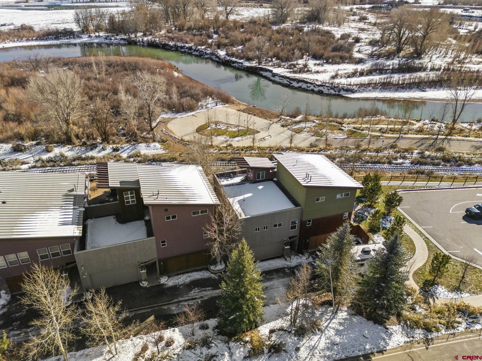 580 Animas View Drive, Unit 1 Durango, CO 81301 - Photo 2 of 43 an aerial view of a house with a lake view