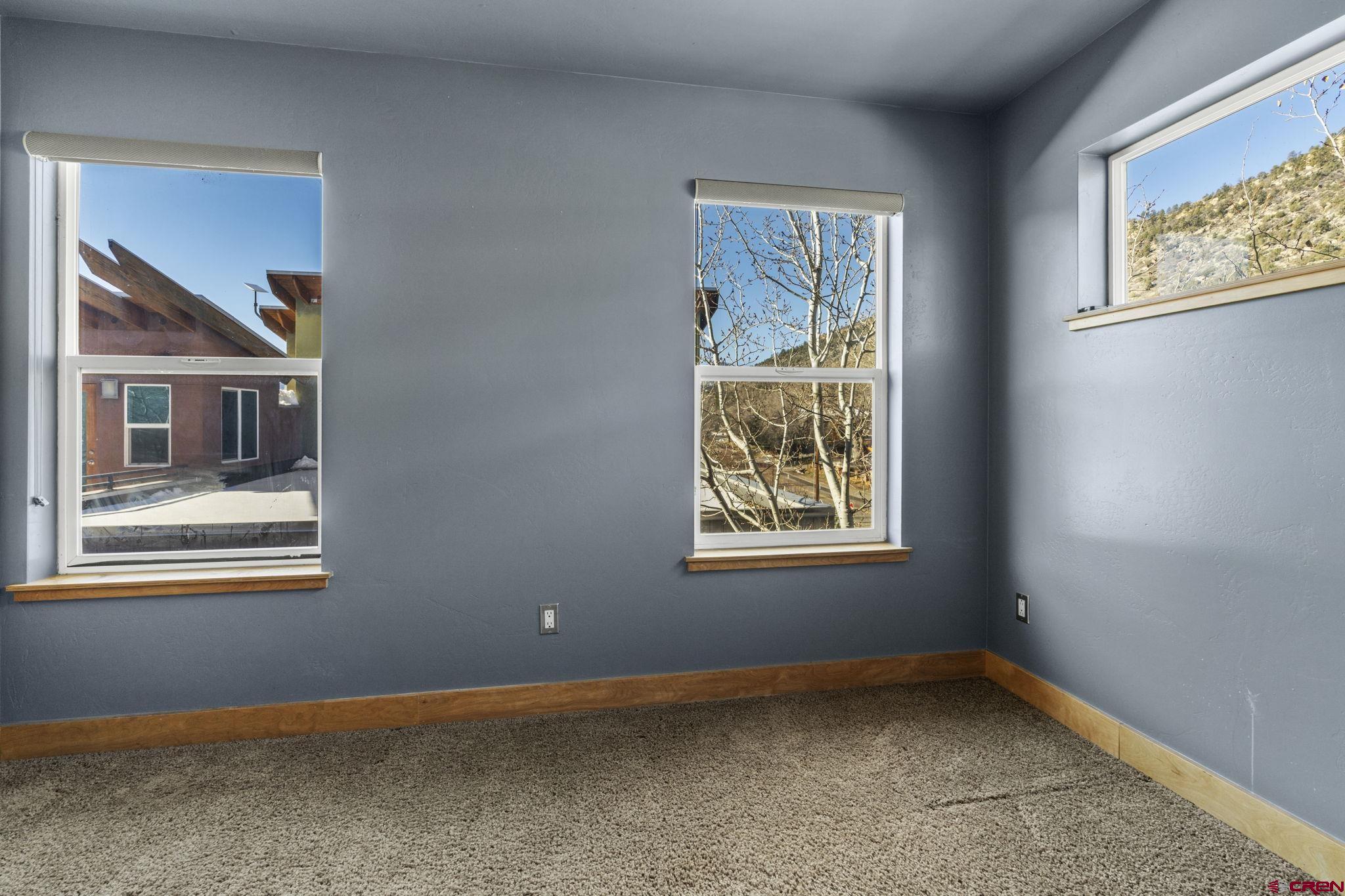 580 Animas View Drive, Unit 1 Durango, CO 81301 - Photo 26 of 43 an empty room with windows