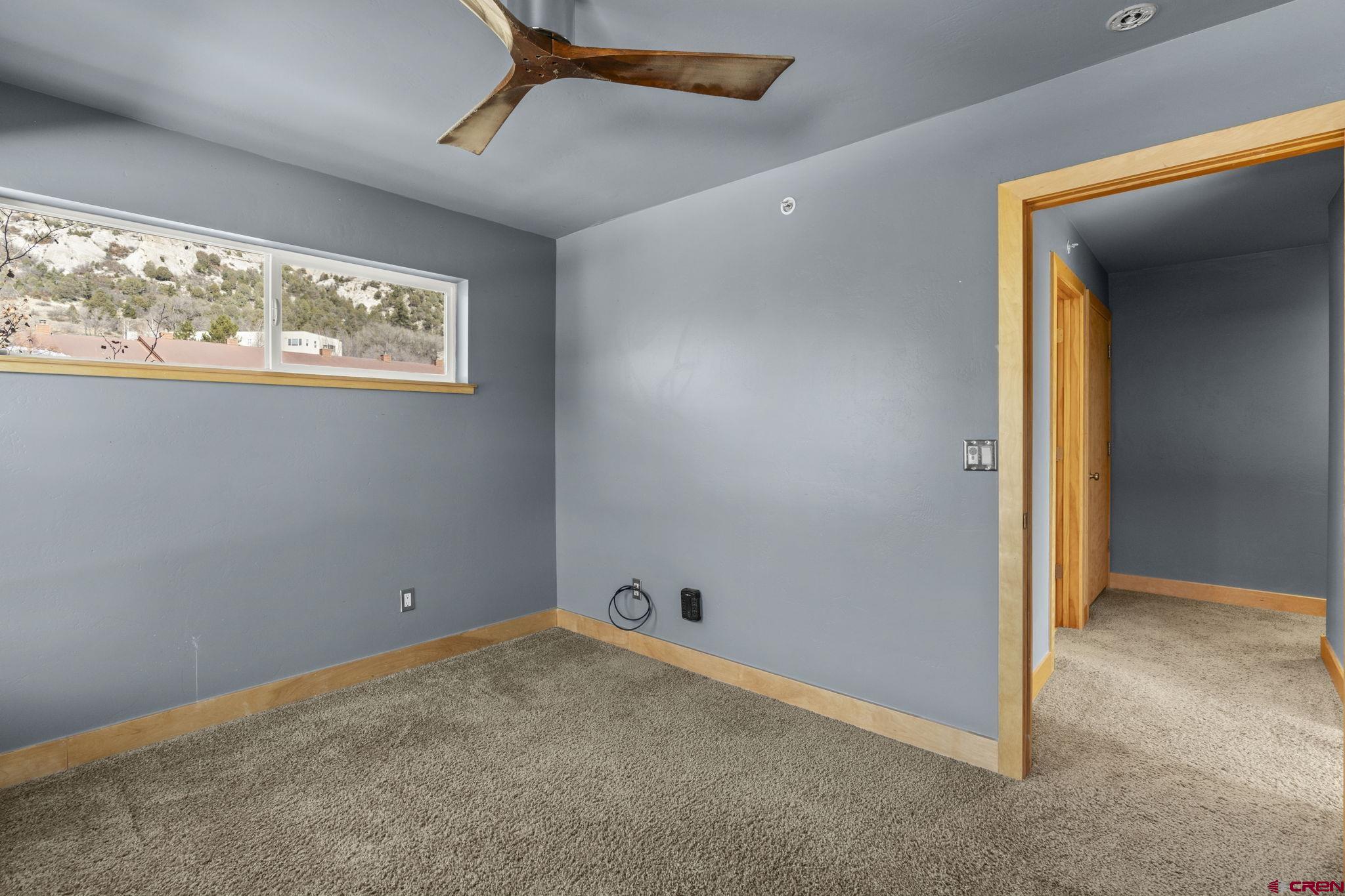580 Animas View Drive, Unit 1 Durango, CO 81301 - Photo 27 of 43 an empty room with windows