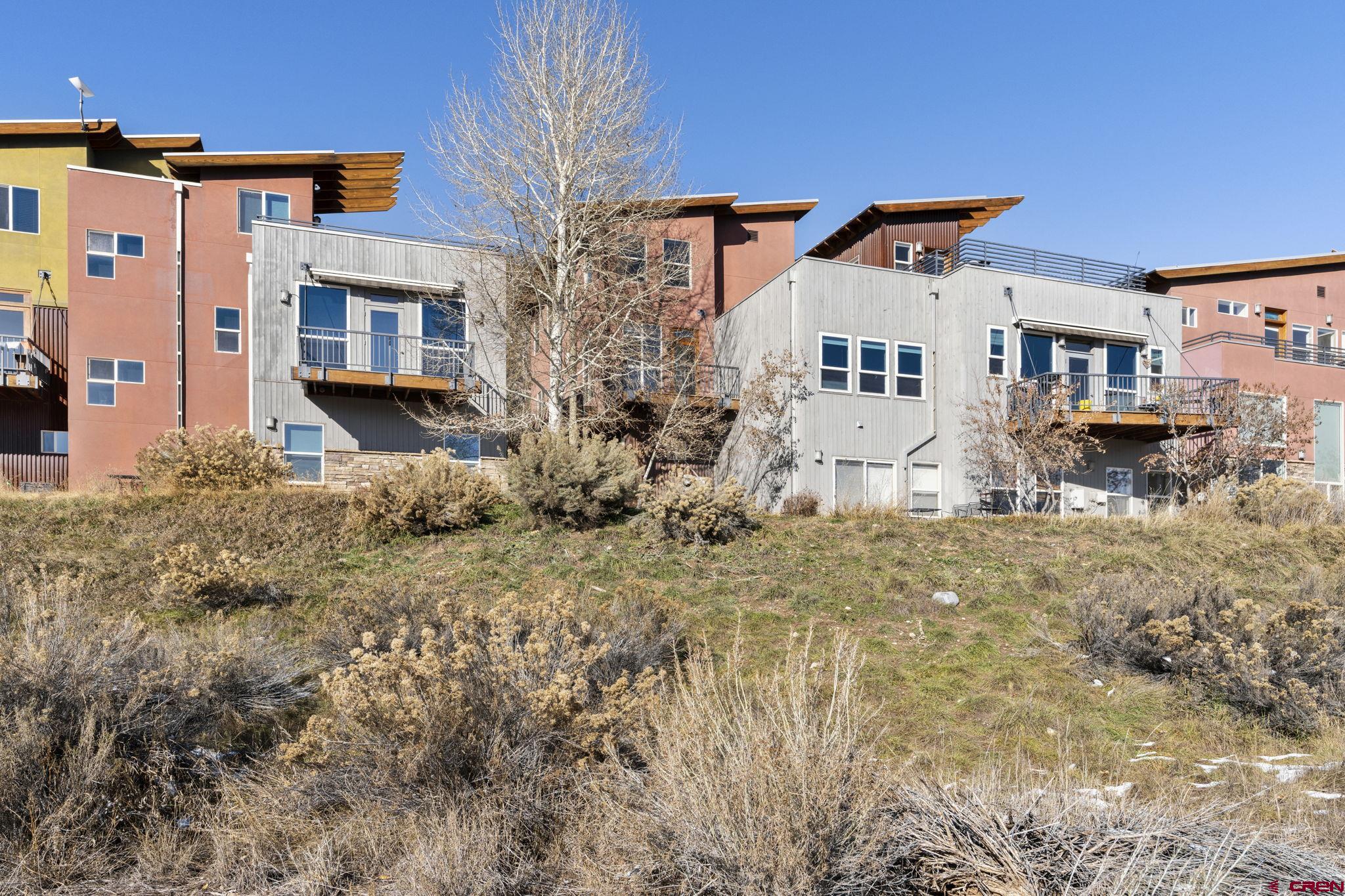580 Animas View Drive, Unit 1 Durango, CO 81301 - Photo 31 of 43 a front view of a house with a yard