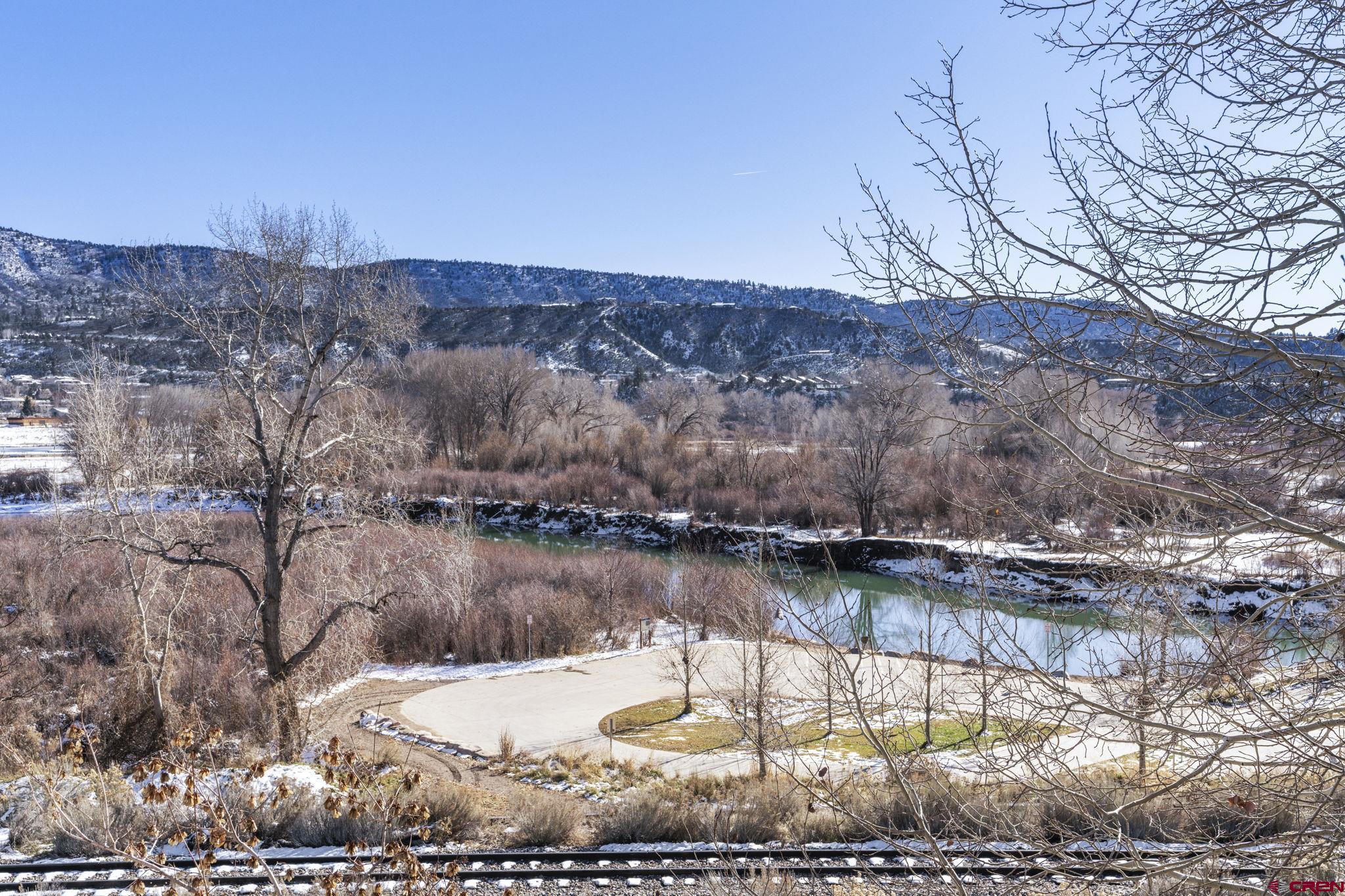 580 Animas View Drive, Unit 1 Durango, CO 81301 - Photo 34 of 43 a view of a lake with a mountain in the background