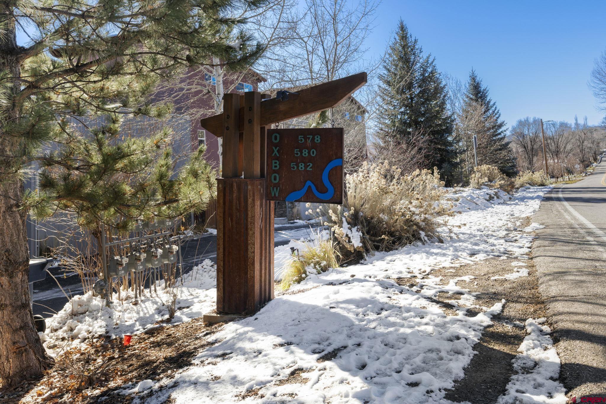 580 Animas View Drive, Unit 1 Durango, CO 81301 - Photo 36 of 43 a view of a house with a yard covered in snow