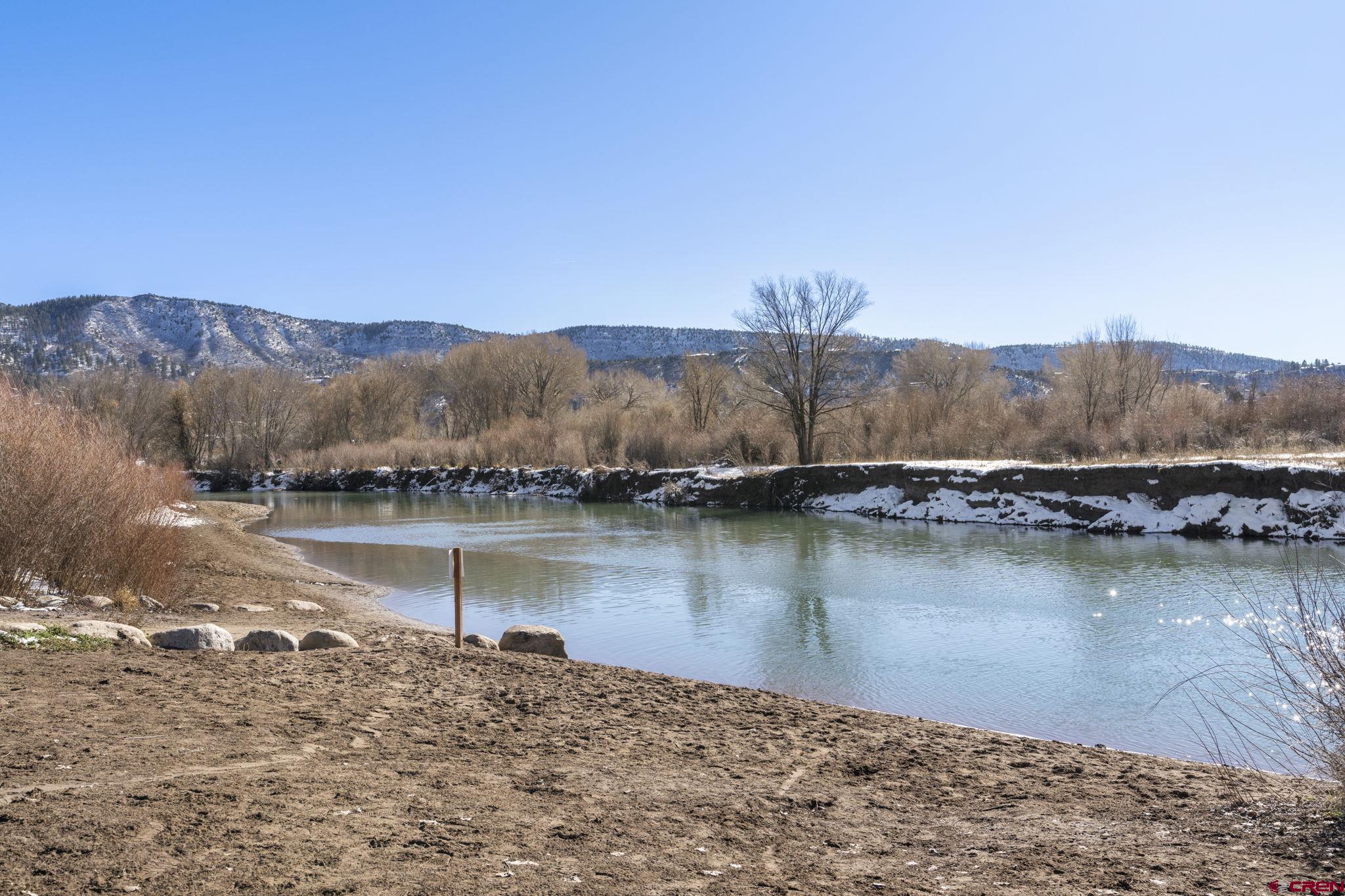 580 Animas View Drive, Unit 1 Durango, CO 81301 - Photo 39 of 43 a view of a lake with a mountain in the background