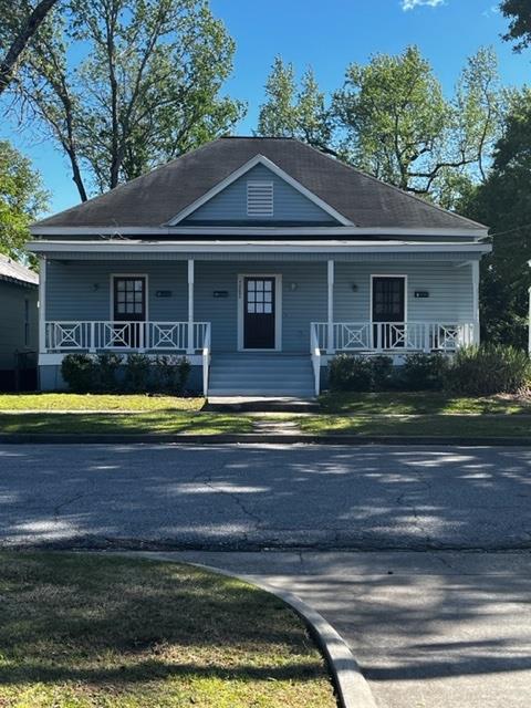 1352 Rhodes Street, Unit B Columbus, GA 31901 - Photo 1 of 12 a front view of a house with a yard