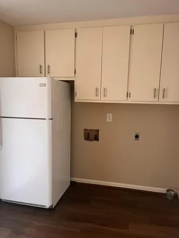 a view of cabinets and wooden floor