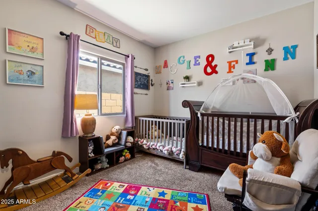 a kitchen with a stove a refrigerator a sink dishwasher a dining table and chairs with wooden floor