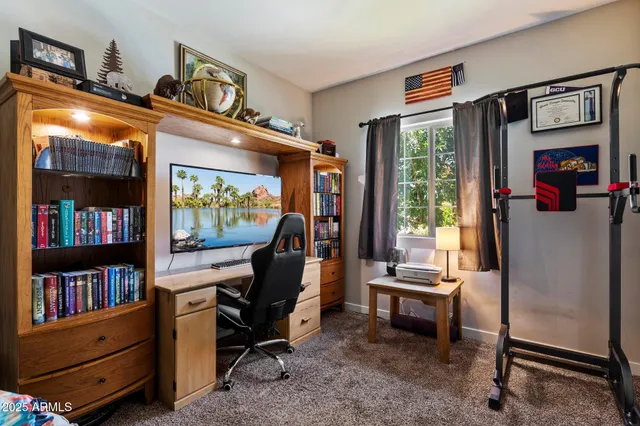 a bedroom with a bed and a lamp next to a window