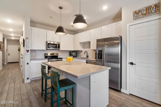 a view of a patio with chairs and a table