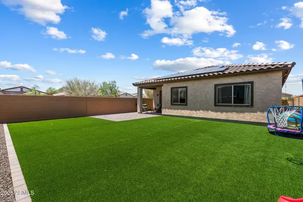 a kitchen with kitchen island a refrigerator a stove a sink and a island with wooden floor