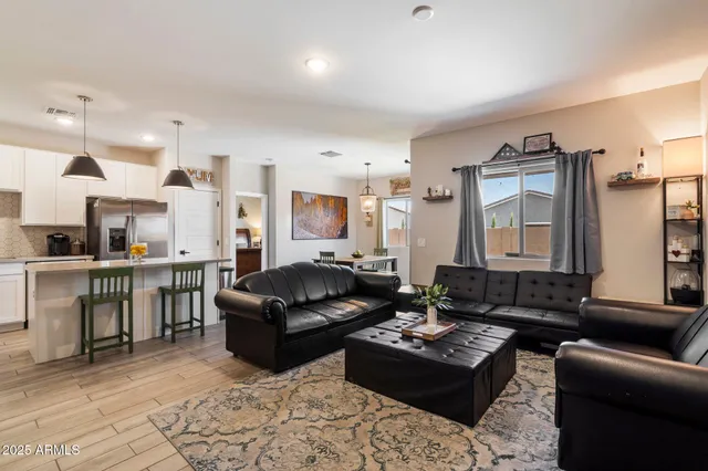 a view of a dining room with furniture wooden floor and chandelier