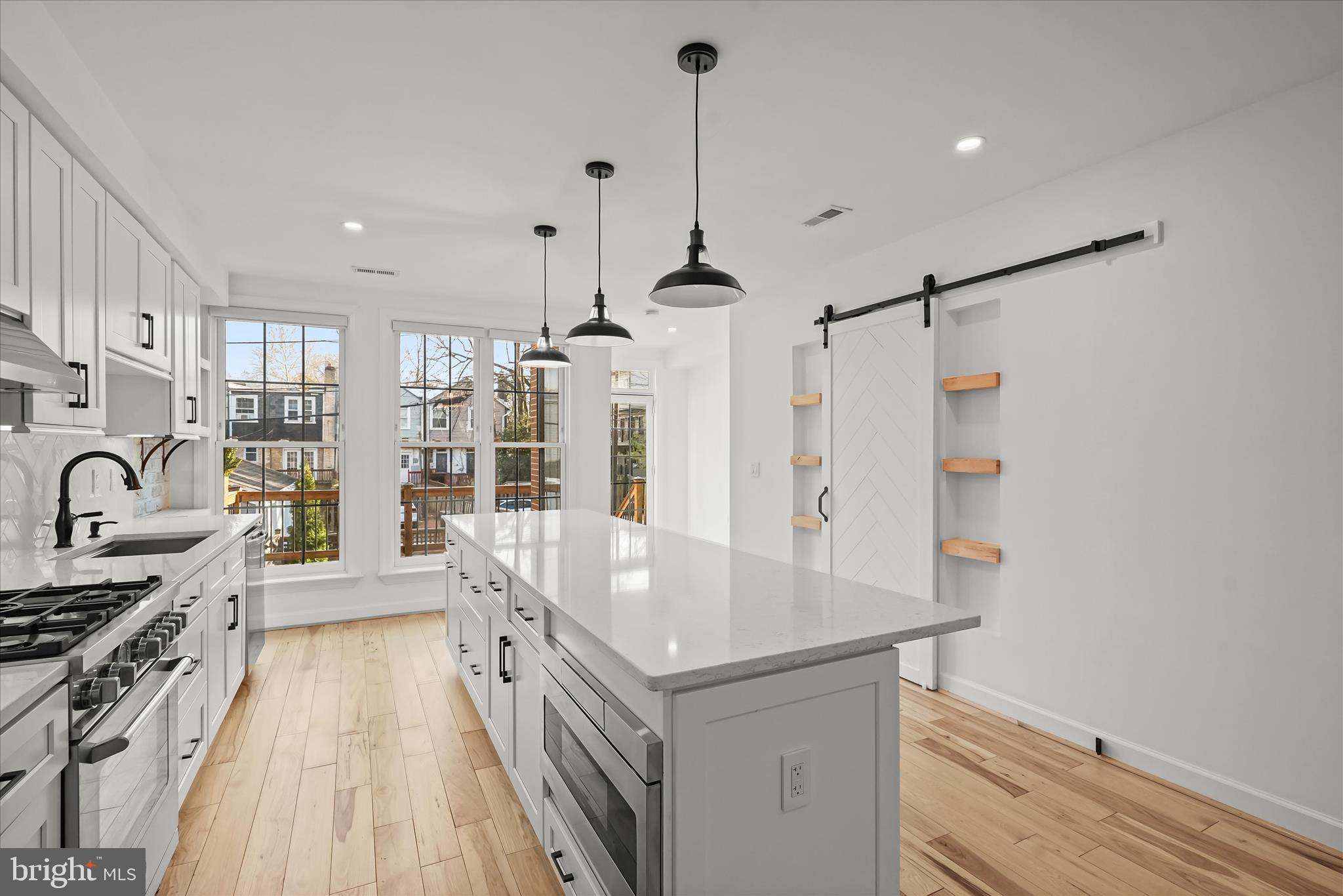 3626 T Street Northwest Washington, DC 20007 - Photo 12 of 61 a kitchen with granite countertop a stove and a wooden floors