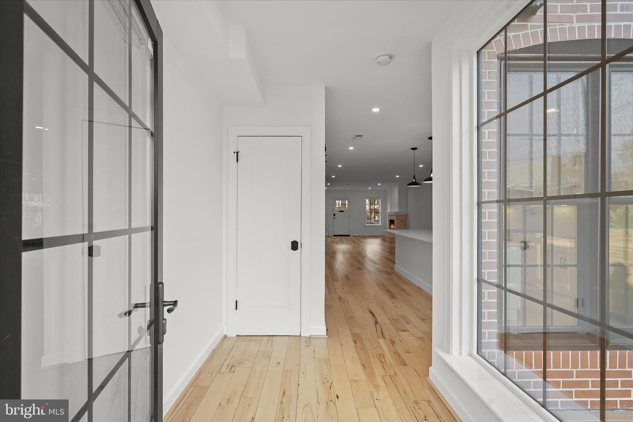3626 T Street Northwest Washington, DC 20007 - Photo 15 of 61 a view of a hallway with wooden floor and a glass door