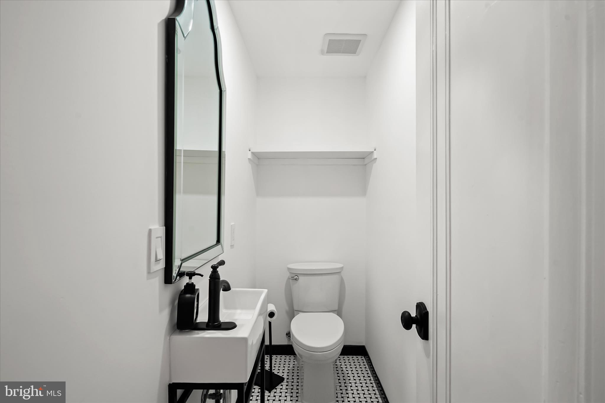 3626 T Street Northwest Washington, DC 20007 - Photo 16 of 61 a bathroom with a toilet