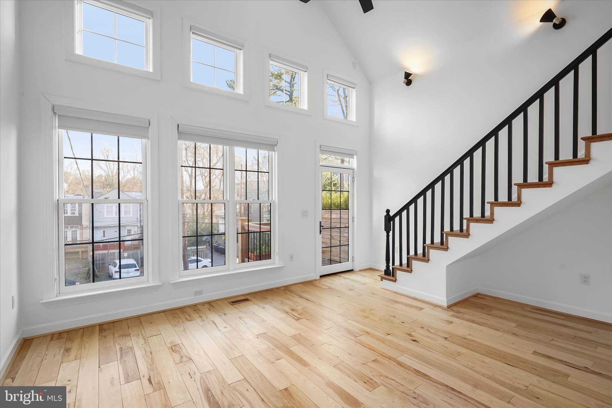 3626 T Street Northwest Washington, DC 20007 - Photo 18 of 61 a view of an empty room with wooden floor and a window