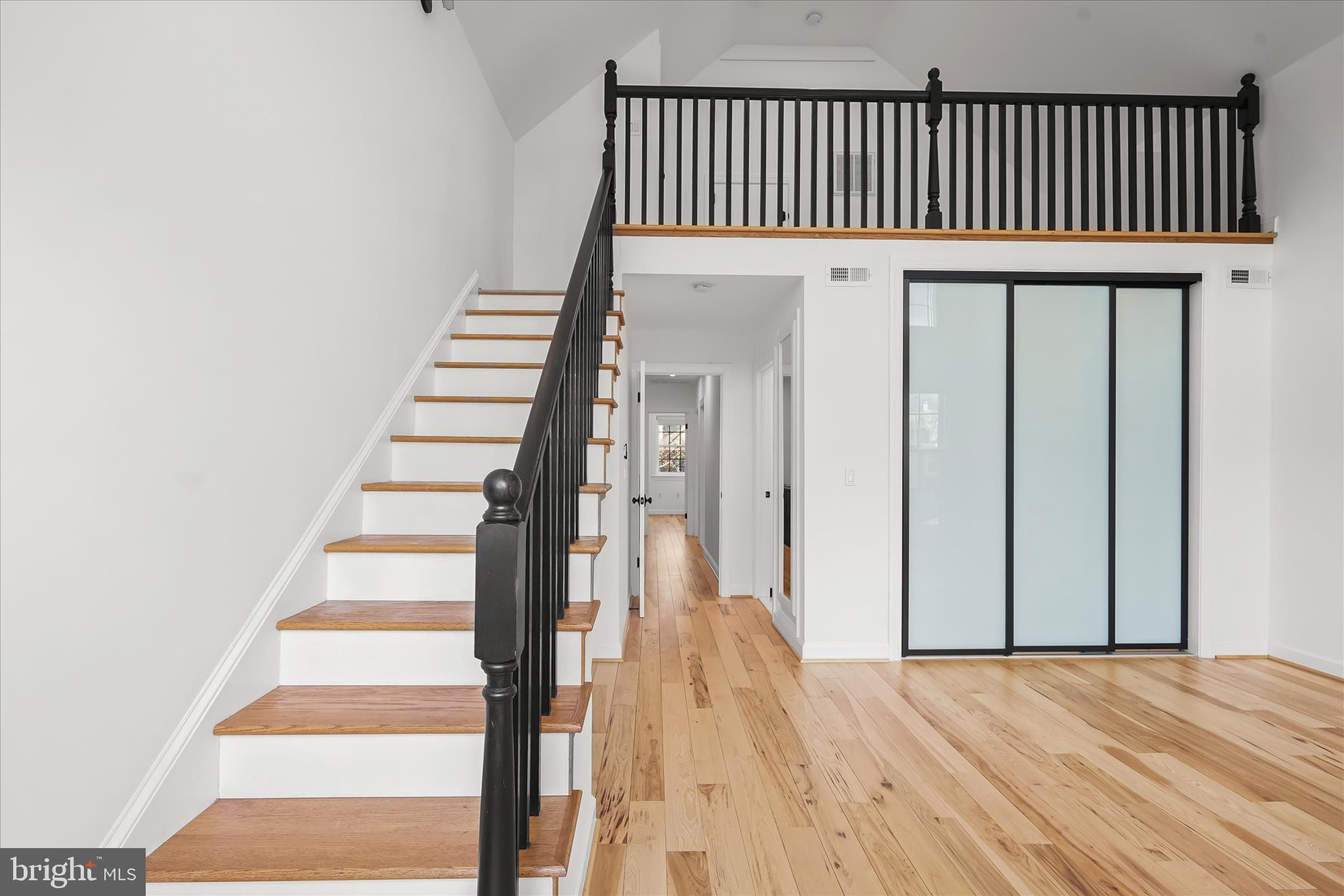 3626 T Street Northwest Washington, DC 20007 - Photo 20 of 61 a view of a hallway with wooden floor and staircase