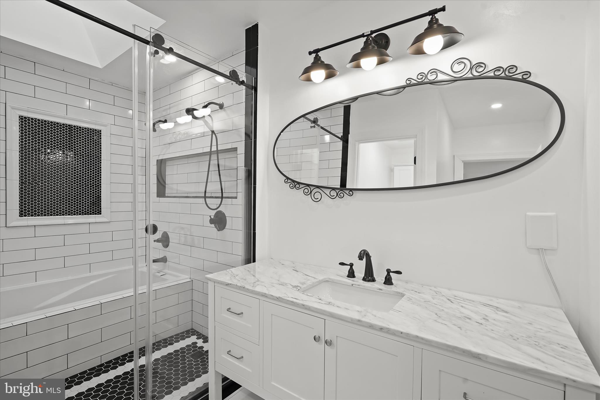 3626 T Street Northwest Washington, DC 20007 - Photo 25 of 61 a bathroom with a granite countertop sink a mirror and shower