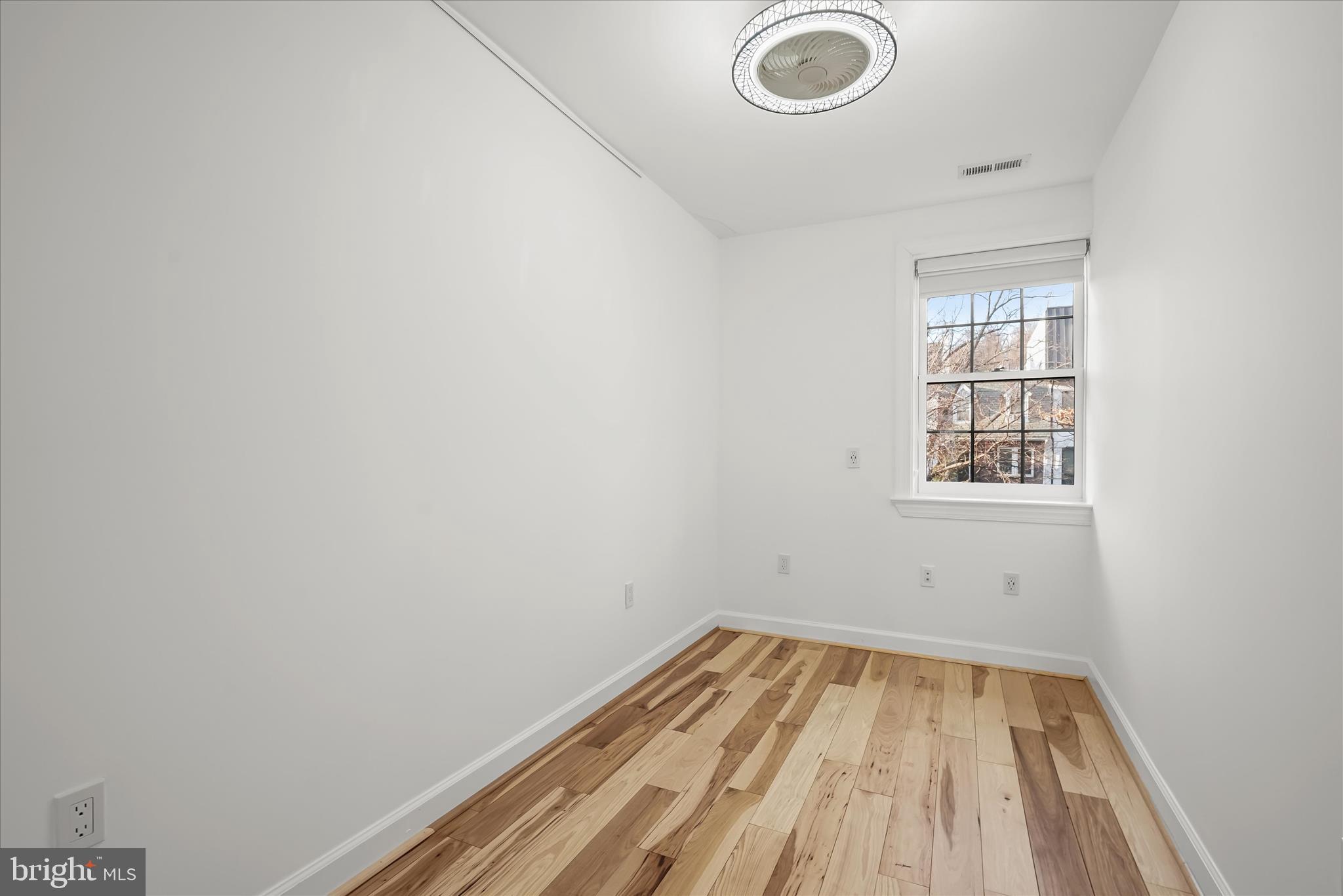 3626 T Street Northwest Washington, DC 20007 - Photo 30 of 61 a view of a room with wooden floor and windows