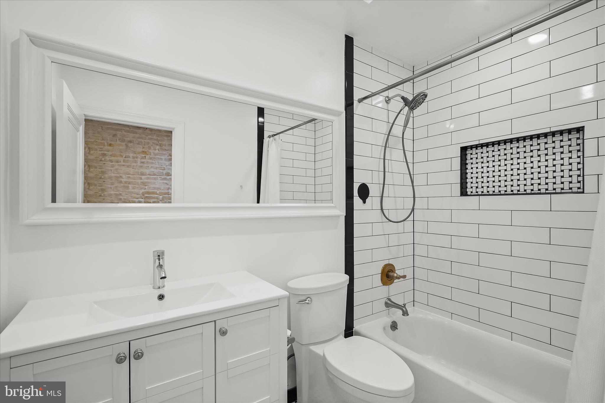 3626 T Street Northwest Washington, DC 20007 - Photo 33 of 61 a bathroom with a sink toilet and shower