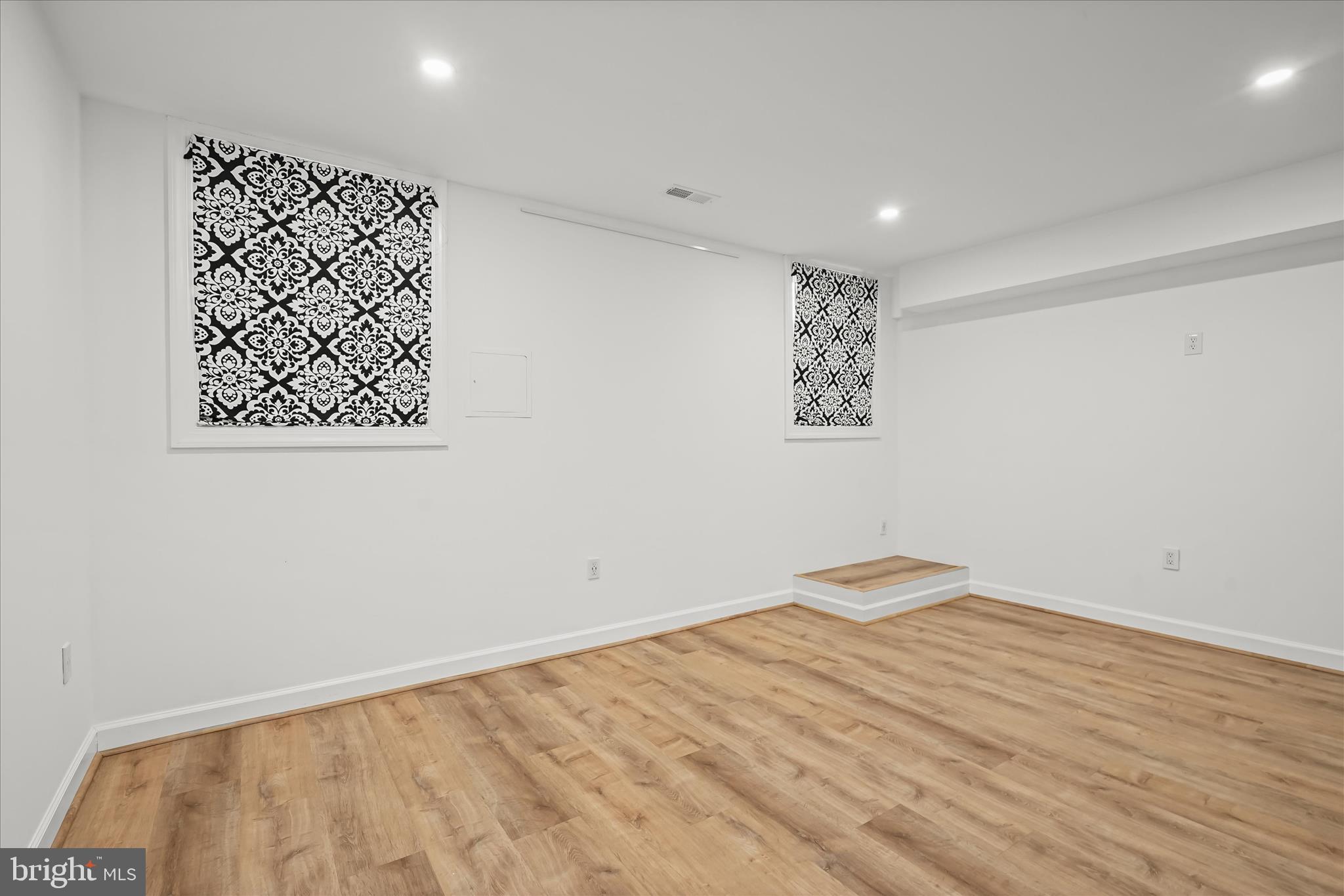 3626 T Street Northwest Washington, DC 20007 - Photo 40 of 61 a view of a room with wooden floor and white walls