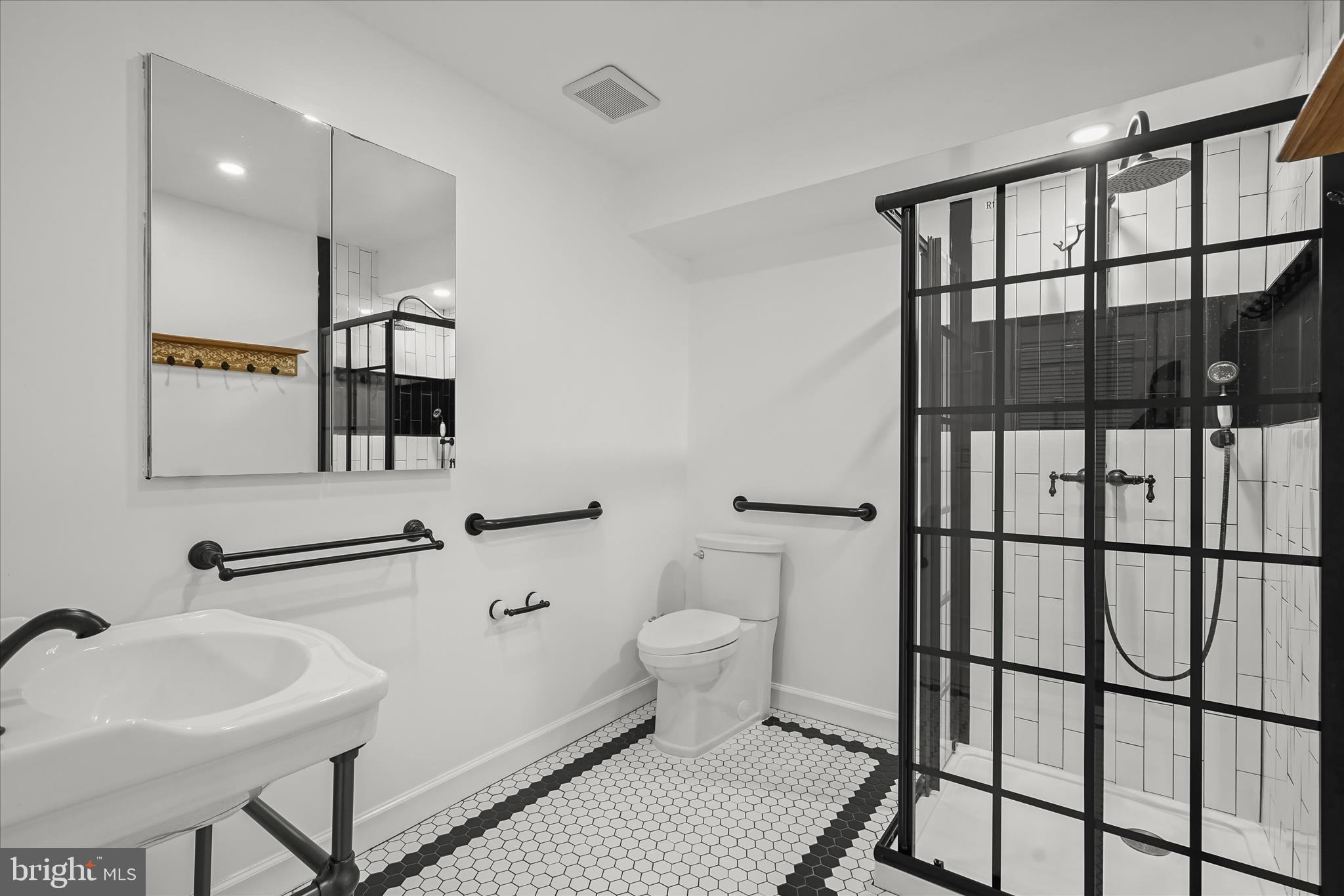 3626 T Street Northwest Washington, DC 20007 - Photo 42 of 61 a bathroom with a sink toilet and mirror