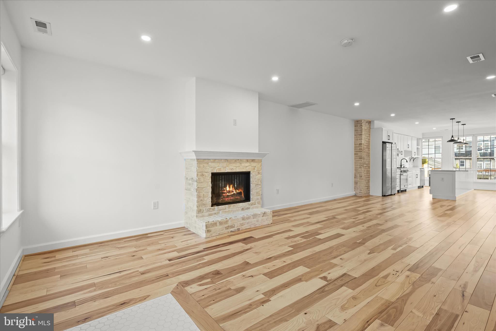 3626 T Street Northwest Washington, DC 20007 - Photo 7 of 61 a view of empty room with wooden floor and fireplace