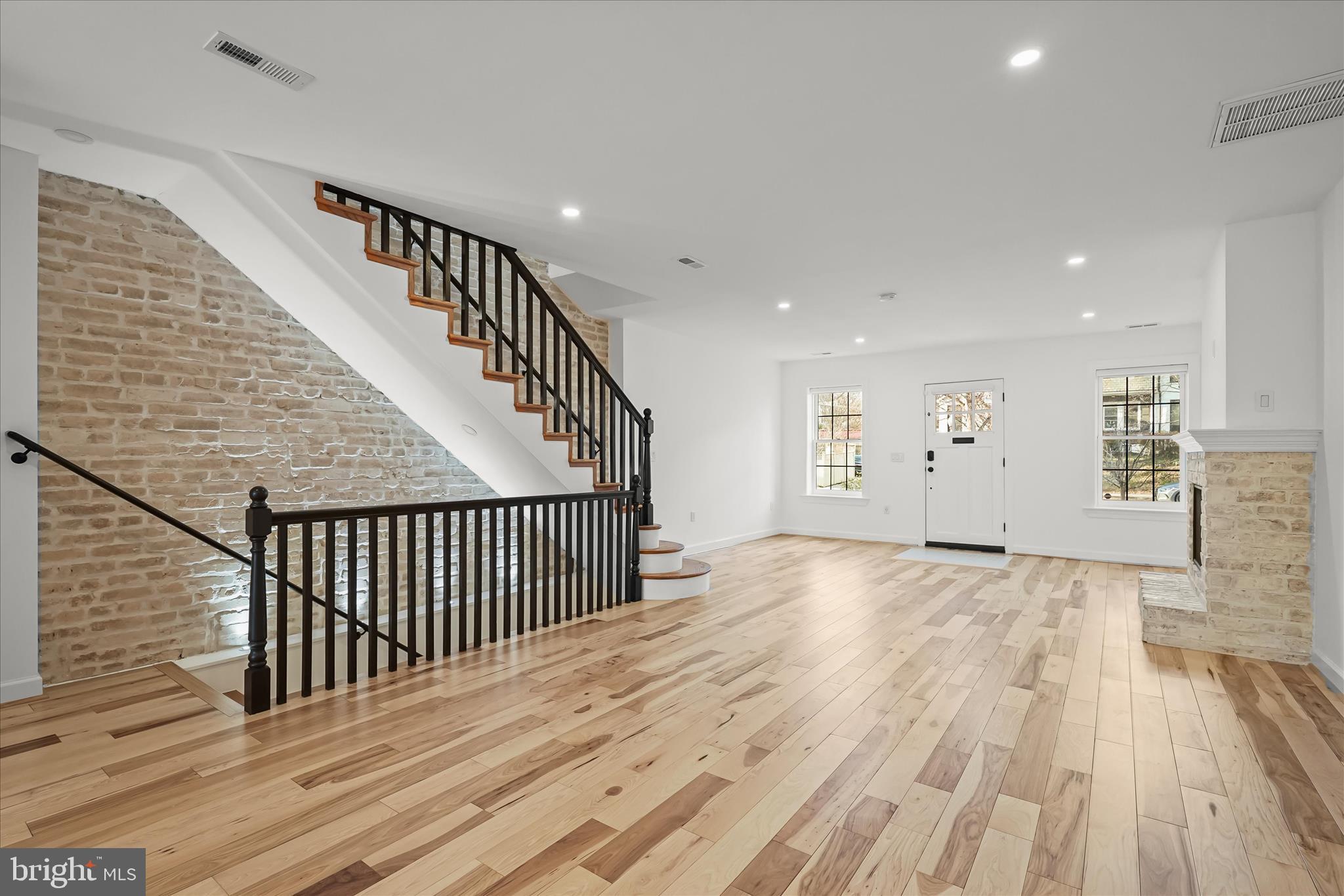 3626 T Street Northwest Washington, DC 20007 - Photo 9 of 61 a view of a hallway with wooden floor and stairs