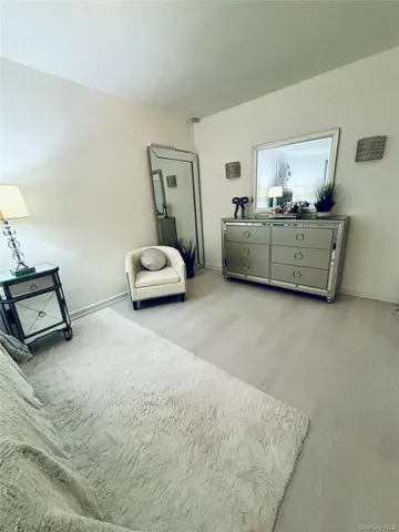 a bedroom with bed and window