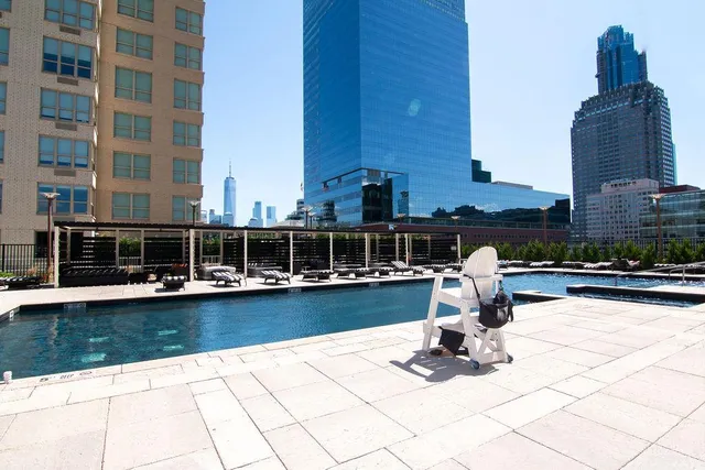 a view of a chairs in backyard of house