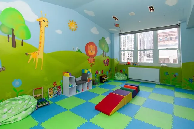 a view of a park with iron fence