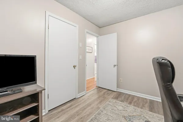 a bedroom with a bed and with a couch