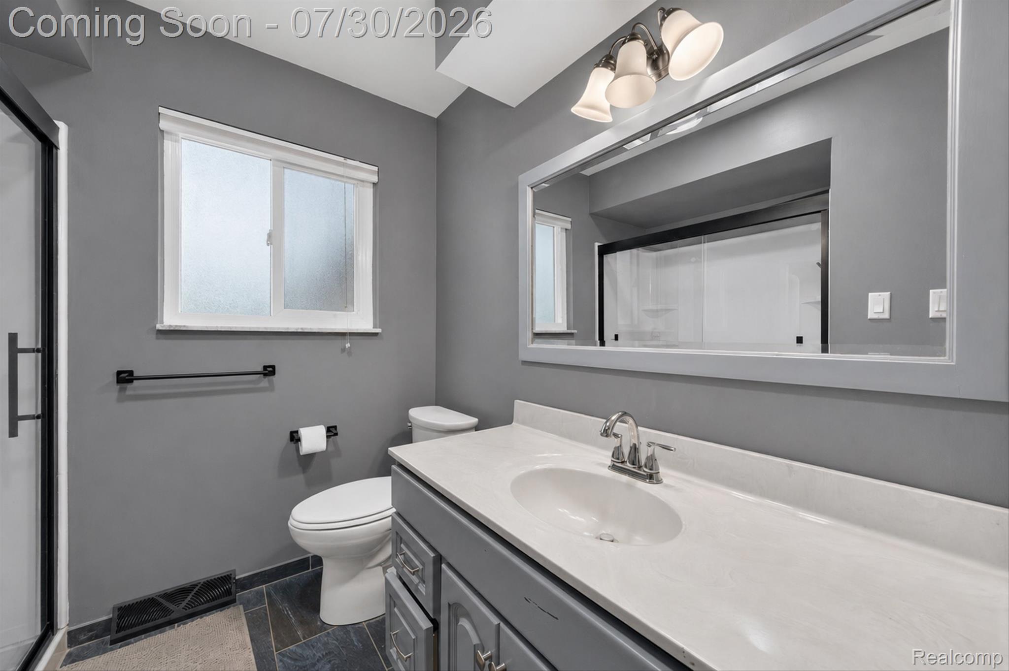 5991 Maybee Road Clarkston, MI 48346 - Photo 20 of 41 Vanity featuring a single undermount sink, a chrome faucet, and a stone-finish countertop