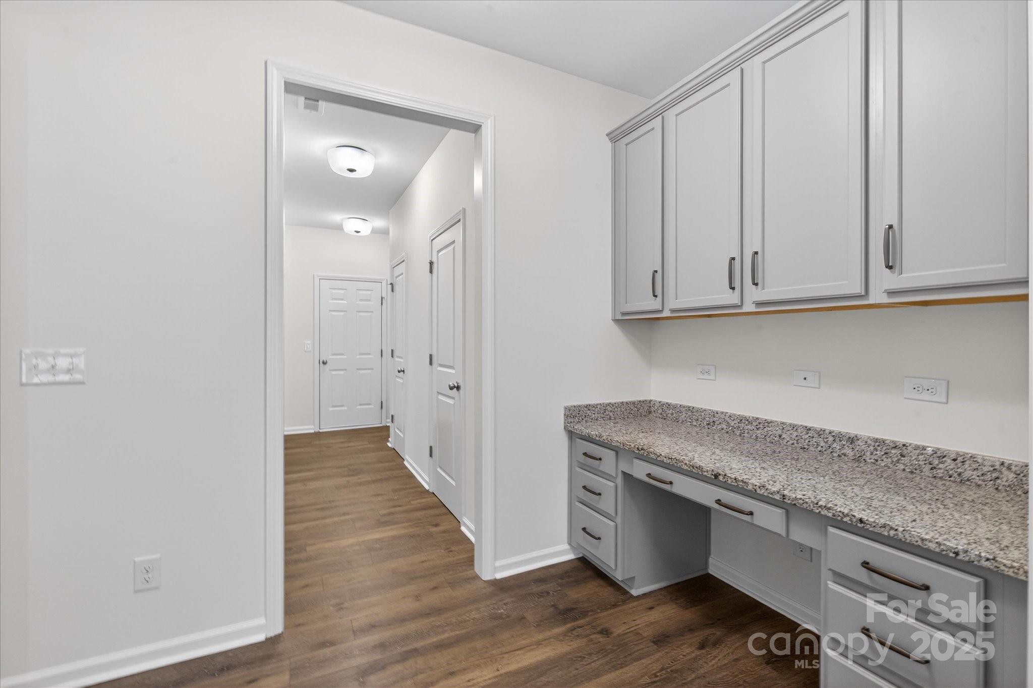 7481 Hartsfield Drive Lancaster, SC 29720 - Photo 13 of 47 a view of cabinets and wooden floor