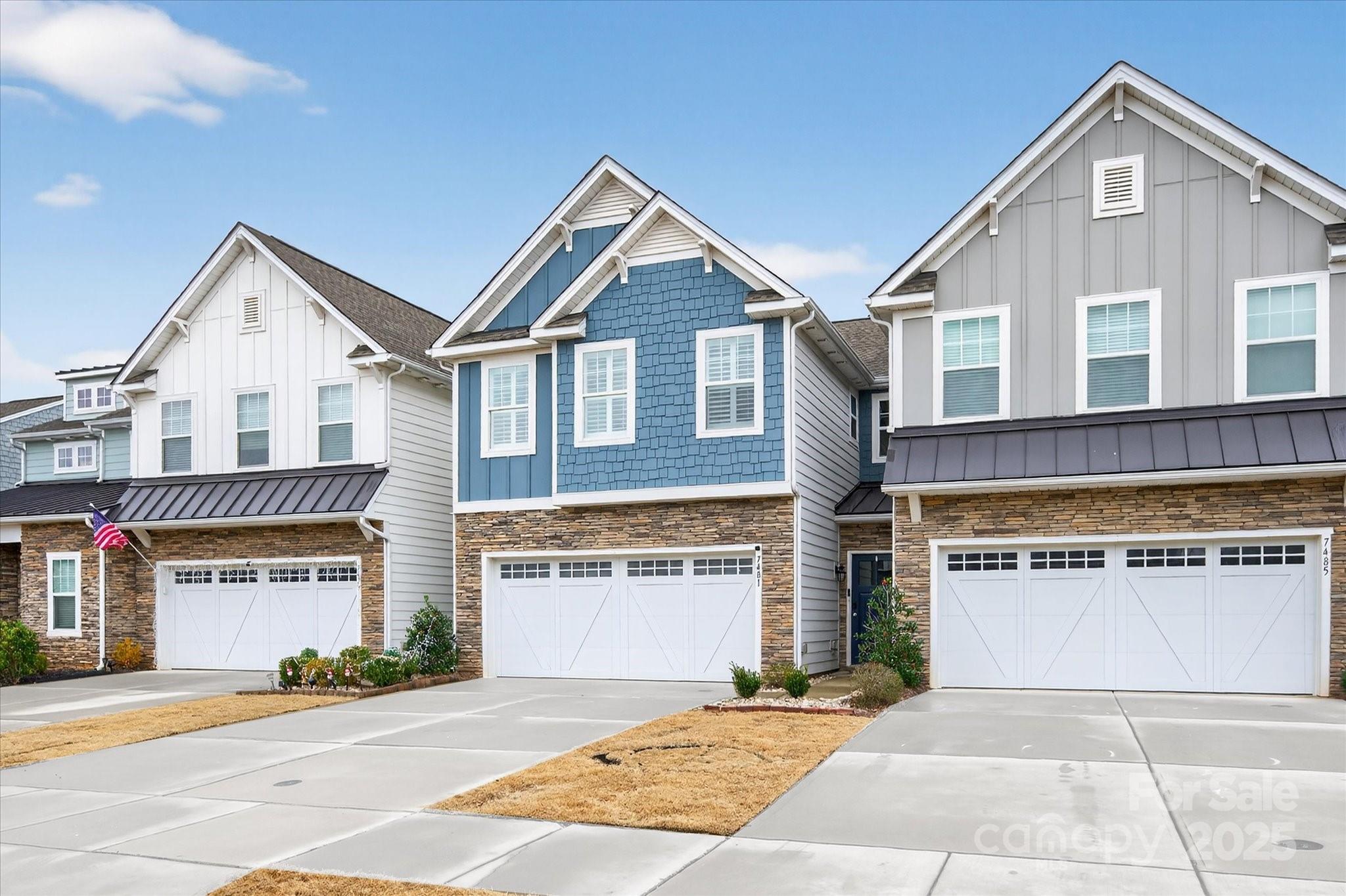 7481 Hartsfield Drive Lancaster, SC 29720 - Photo 2 of 47 a front view of a house with a yard and garage