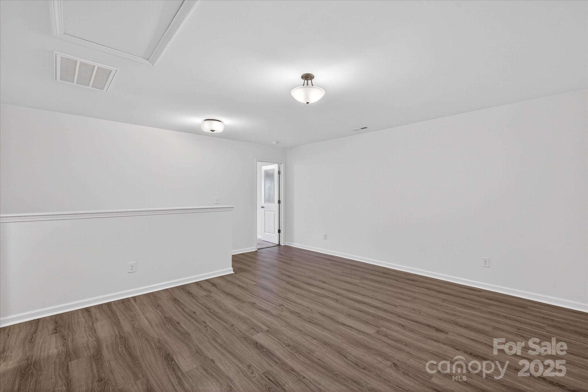 7481 Hartsfield Drive Lancaster, SC 29720 - Photo 23 of 47 a view of an empty room with wooden floor