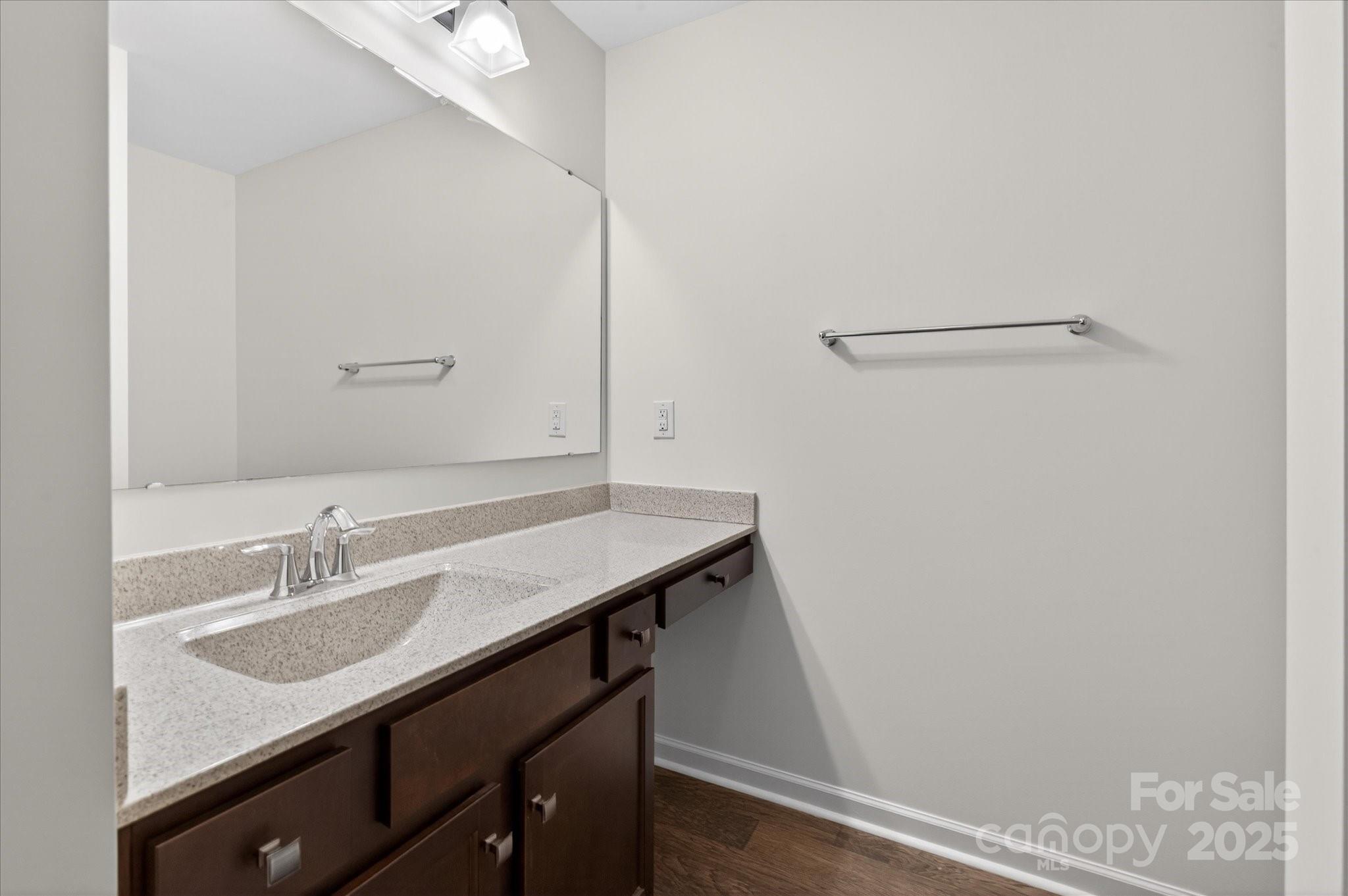 7481 Hartsfield Drive Lancaster, SC 29720 - Photo 31 of 47 a bathroom with a sink vanity and a mirror