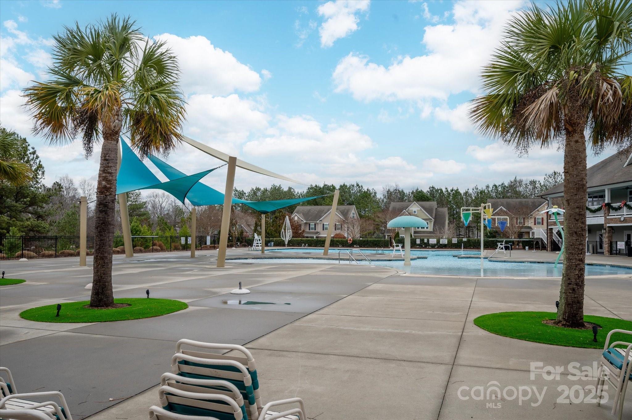7481 Hartsfield Drive Lancaster, SC 29720 - Photo 44 of 47 a front view of multi story residential apartment building with yard and sign board
