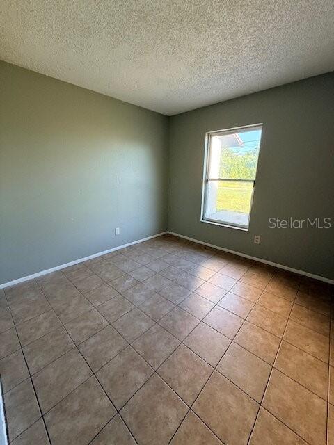 11090 Pendleton Avenue, Unit B Englewood, FL 34224 - Photo 5 of 10 an empty room with a window