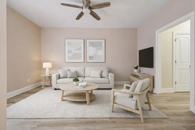 a living room with furniture and a flat screen tv