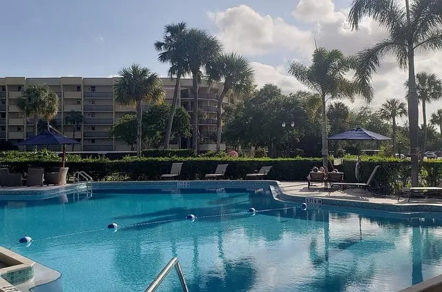 a view of swimming pool with outdoor seating
