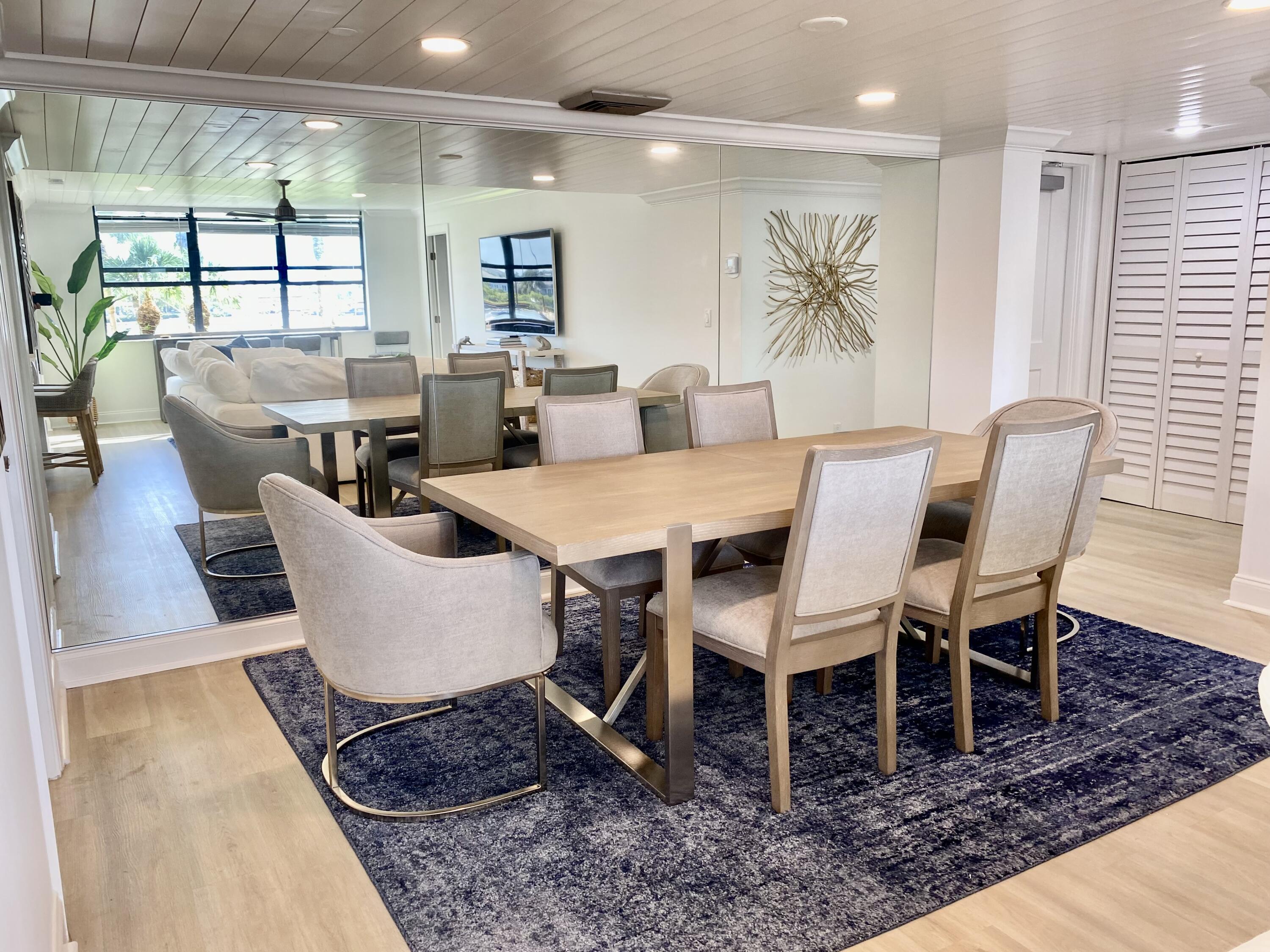 1648 Jupiter Cove Drive, Unit 210 Jupiter, FL 33469 - Photo 8 of 15 a view of a dining room with furniture