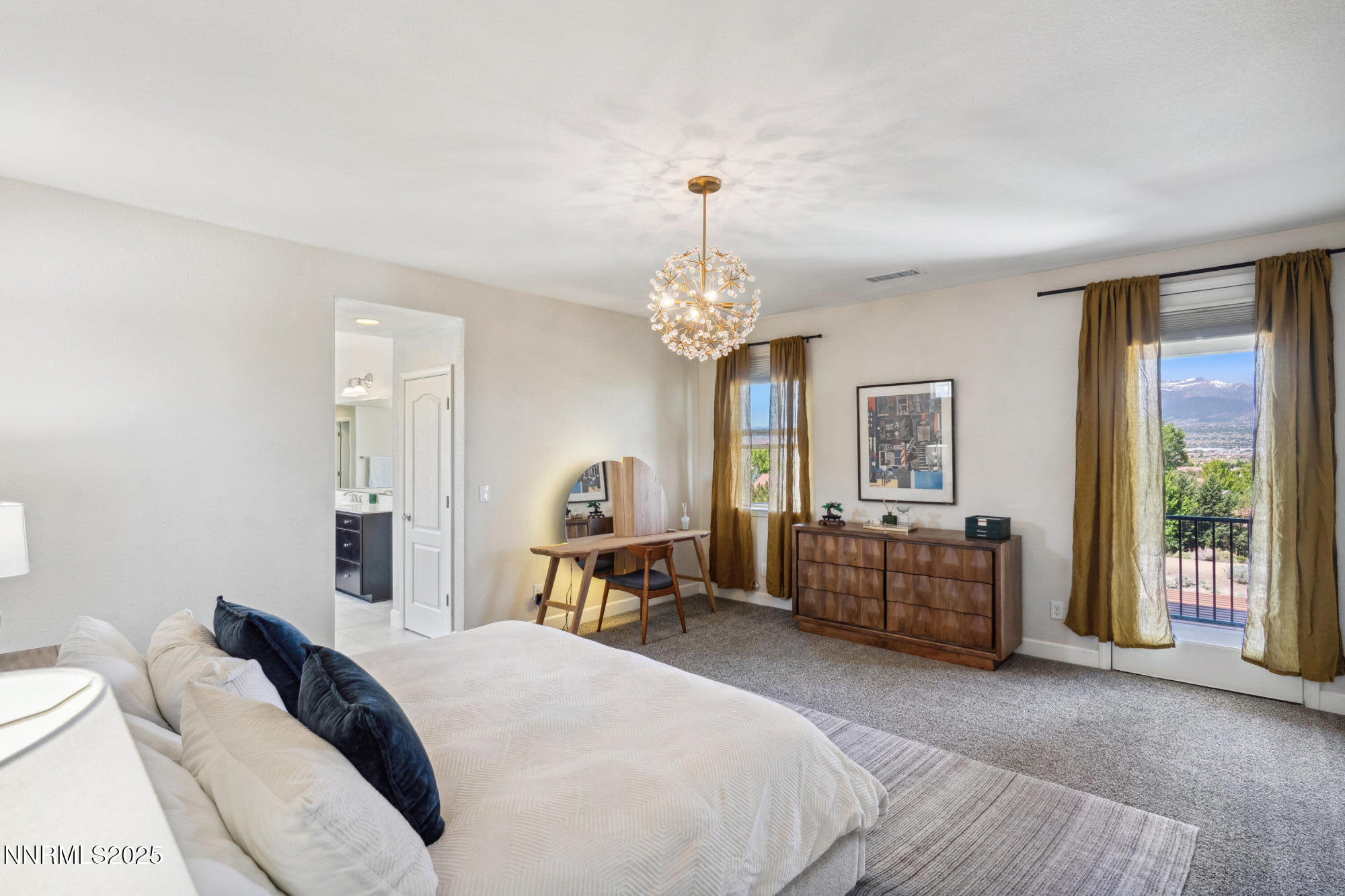 2780 Trail Rider Drive Reno, NV 89521 - Photo 13 of 54 a bedroom with a bed and a chandelier