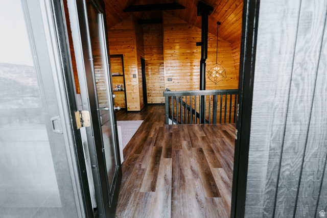 1413 Basel Drive Midway, UT 84049 - Photo 56 of 137 Hall featuring an upstairs landing, wooden ceiling, dark wood-style floors, and wood walls