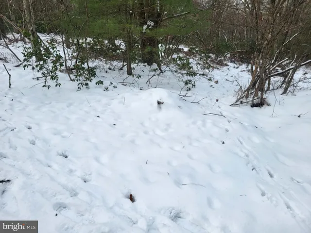 a view of white fence of a house