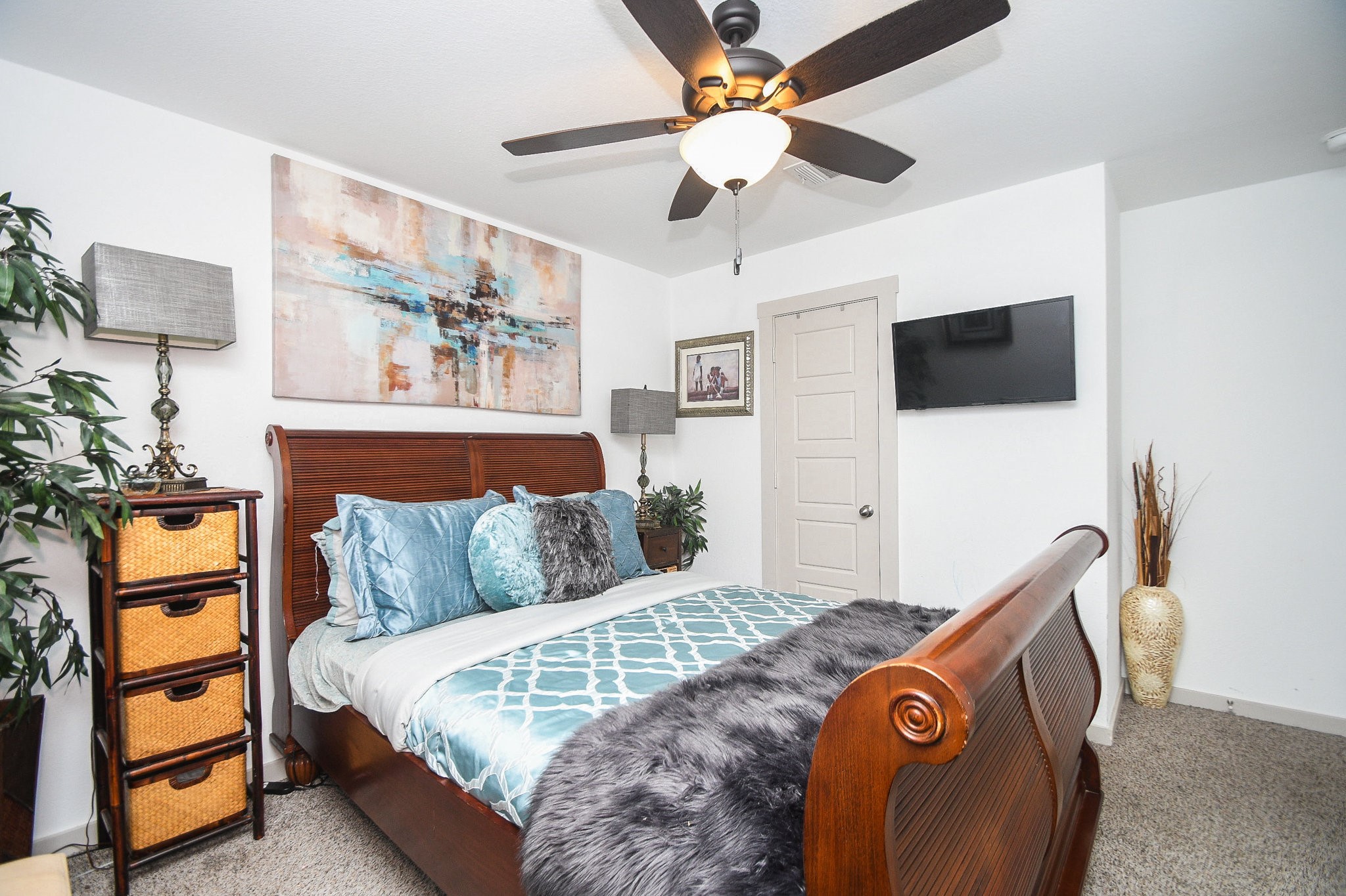 7723 Golden Rubia Lane Rosharon, TX 77583 - Photo 23 of 34 a bedroom with a bed and a flat screen tv