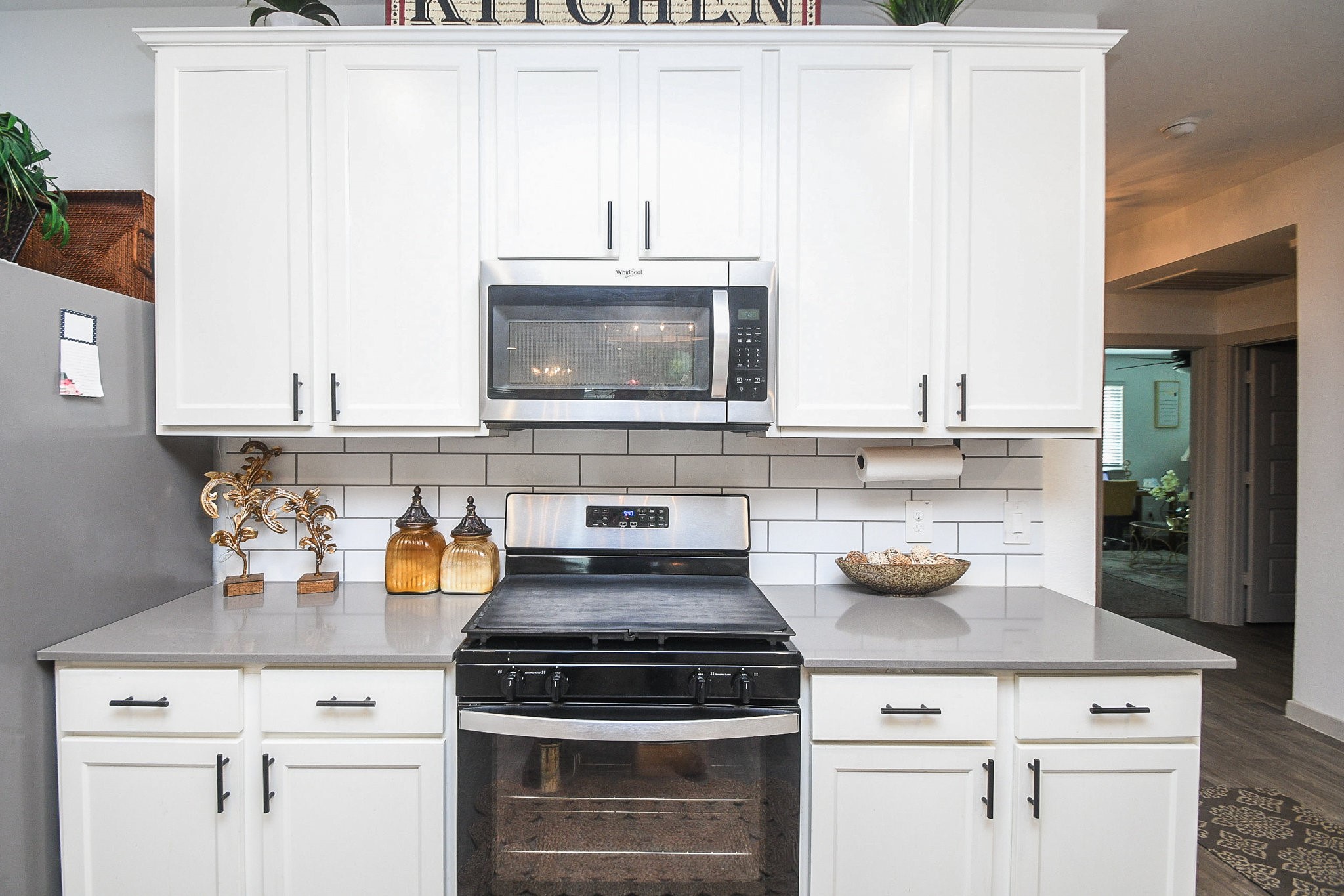 7723 Golden Rubia Lane Rosharon, TX 77583 - Photo 8 of 34 a stove top oven sitting inside of a kitchen and a sink